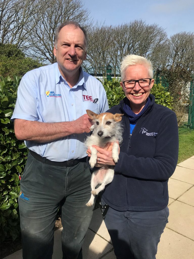 Louise Clark-Payne, Manager of Cornwall National Animal Welfare Trust with Alan Denham of Mr. Electric Cornwall and one of the rescue dogs